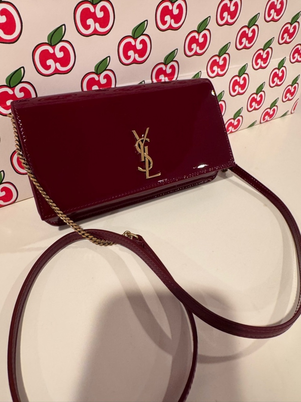 SAINT LAURENT CASSANDRE PHONE HOLDER IN PATENT LEATHER
GRENADE - Picture 3 of 7